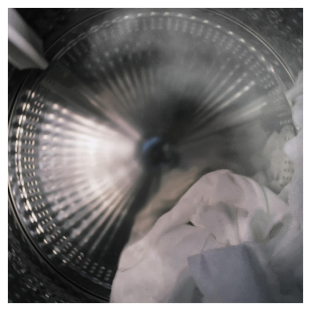 GE-PFW870SPVRS-Interior of a Washing Machine with Steam and Laundry