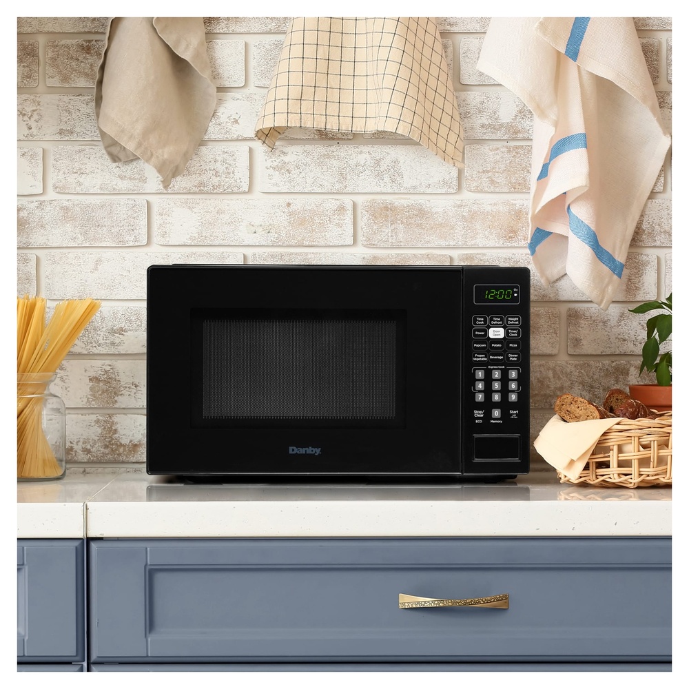 Danby DBMW0721B 18 inch 0.7 cu. ft. Countertop Microwave with 700 Watts, 10 Power Levels, 6 Auto Cook Options, Express Cook, Auto Defrost, Child Lock and Electronic Touch Controls