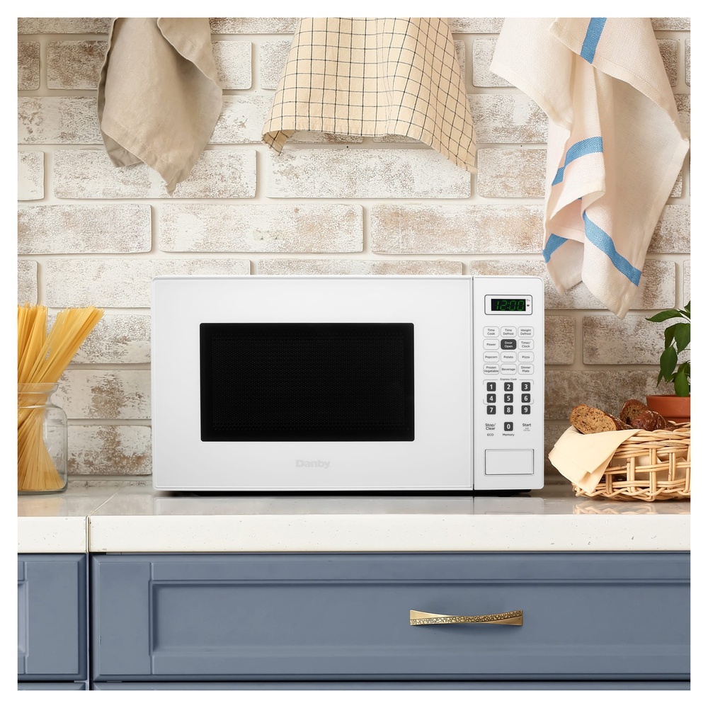 Danby DBMW0721B 18 inch 0.7 cu. ft. Countertop Microwave with 700 Watts, 10 Power Levels, 6 Auto Cook Options, Express Cook, Auto Defrost, Child Lock and Electronic Touch Controls